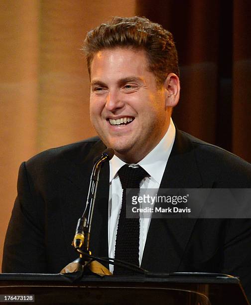 Actor Jonah Hill speaks onstage at the Hollywood Foreign Press Association's 2013 Installation Luncheon at The Beverly Hilton Hotel on August 13,...