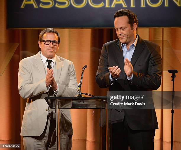 Director David O. Russell and actor Vince Vaughn speak onstage at the Hollywood Foreign Press Association's 2013 Installation Luncheon at The Beverly...