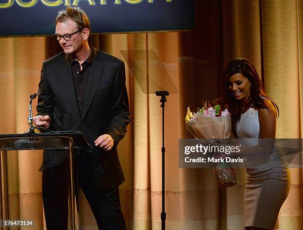 President Theo Kingma and host Eva Longoria speak onstage at the Hollywood Foreign Press Association's 2013 Installation Luncheon at The Beverly...