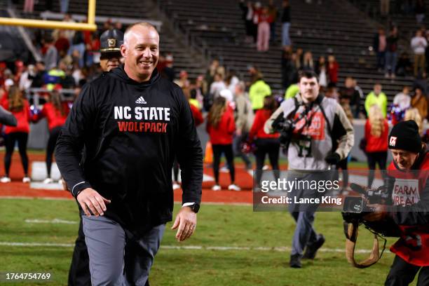 Head coach Dave Doeren of the NC State Wolfpack smiles following their 20-6 victory against the Miami Hurricanes at Carter-Finley Stadium on November...