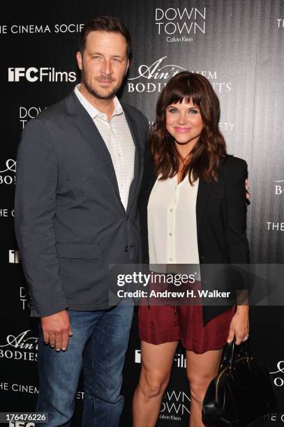 Brady Smith and Actress Tiffani Thiesse attend the Downtown Calvin Klein with The Cinema Society screening of IFC Films' "Ain't Them Bodies Saints"...