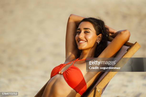 young woman in bikini posing on the beach, alanya beach, antalya, turkiye - tanned body stock pictures, royalty-free photos & images