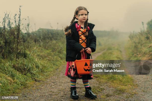 littel girl dressed as a witch for trick or treat - cleaning equipment stock pictures, royalty-free photos & images