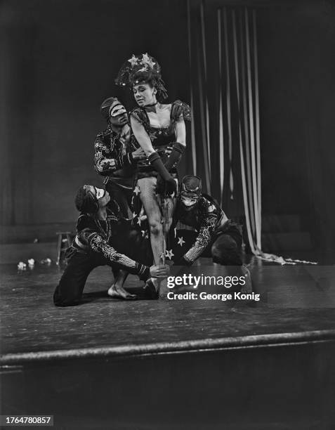 Choreographer Katherine Dunham and masked dancers performing in 'A Caribbean Rhapsody' at the Prince of Wales Theatre in London, June 1948.