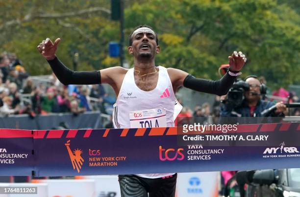 Ethiopia's Tamirat Tola celebrates winning the 52nd Edition of the New York City Marathon on November 5, 2023.