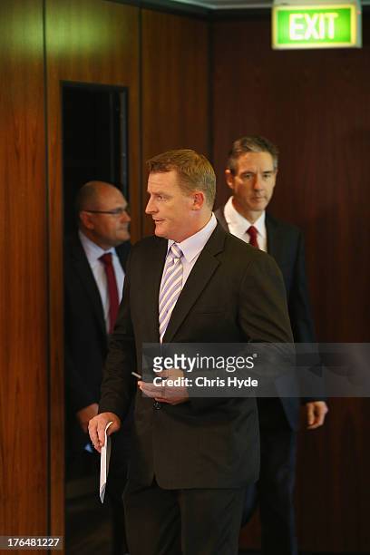 Former Lions coach Michael Voss arrives at a Brisbane Lions AFL media conference followed by Lions Chairman Angus Johnson and CEO Malcolm Holmes at...