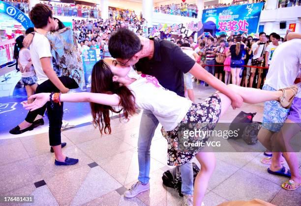 Chinese lovers kiss during a competition to greet the Chinese Valentine's Day on August 13, 2013 in Shenyang, China. The Chinese Valentine's Day...