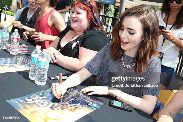 Lily Collins attends the 'The Mortal Instruments: City Of Bones' meet and greet at The Americana at Brand on August 13, 2013 in Glendale, California.