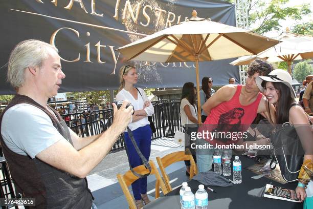 Harald Zwart and Robert Sheehan attend the 'The Mortal Instruments: City Of Bones' meet and greet at The Americana at Brand on August 13, 2013 in...