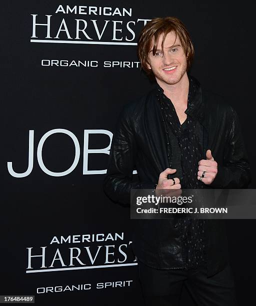 Actor Eddie Hassell poses on arrival for the Los Angeles special screening of the film 'JOBS' in Los Angeles California on August 13, 2013 based on...
