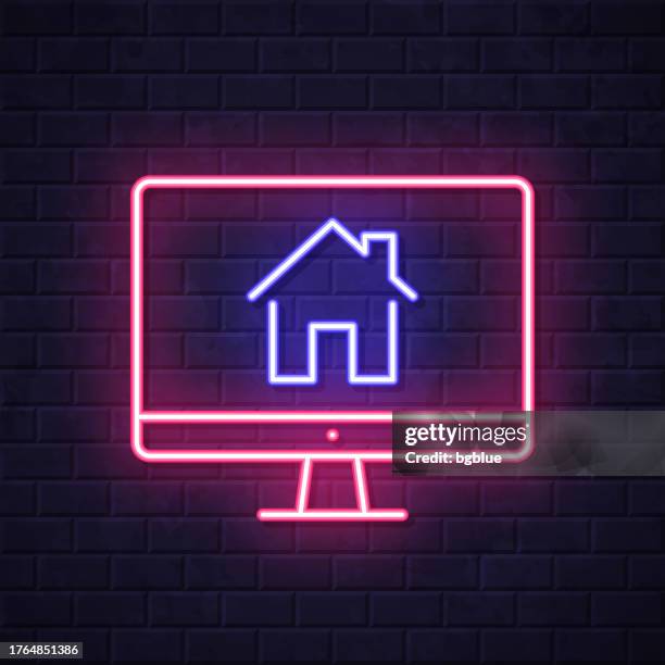 desktop computer with smart home. glowing neon icon on brick wall background - tv wall stock illustrations