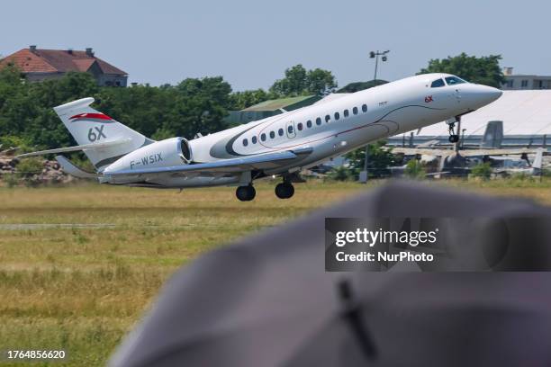 Dassault Falcon 6X aircraft seen taking off and flying during a flight demonstration at International Paris Air Show 2023 in Le Bourget Airport. The...