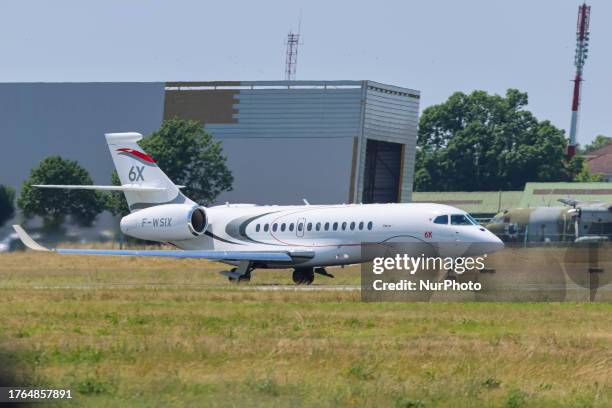 Dassault Falcon 6X aircraft seen taking off and flying during a flight demonstration at International Paris Air Show 2023 in Le Bourget Airport. The...