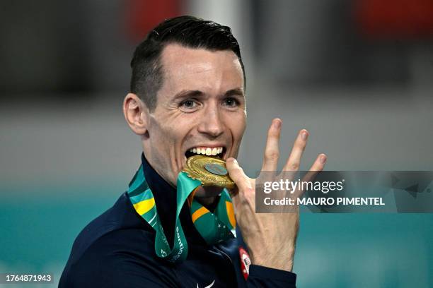 Thomas Scott poses with his gold medal on the podium of the karate men's -75kg event of the Pan American Games Santiago 2023, at the Contact Sports...