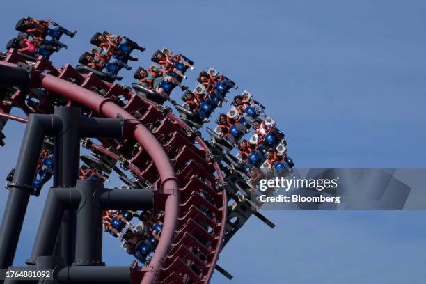 Guests ride a rollercoaster at Six Flags Magic Mountain theme park in Valencia, California, US, on Saturday, Nov. 4, 2023. Cedar Fair Entertainment...