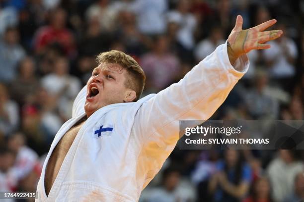 Finland's Martti Puumalainen celebrates after defeating Georgia's Guram Tushishvili in the men's +100 kg final during the European Judo Championships...
