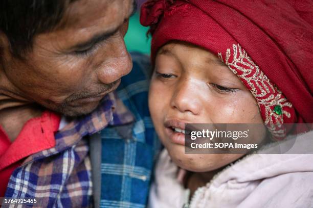 Girl mourns during her family cremation procession of earthquake victims at Chiuri village in Jajarkot district, northwestern Nepal. As many as 157...