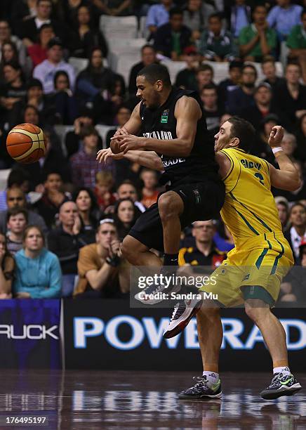 Cory Webster of New Zealand and Adam Gibson of Australia in action during the Men's FIBA Oceania Championship match between the New Zealand Tall...