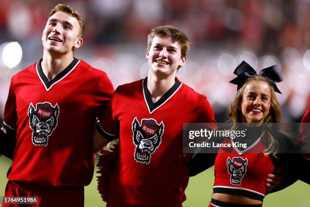 Cheerleaders of the NC State Wolfpack perform during the game against the Miami Hurricanes at Carter-Finley Stadium on November 4, 2023 in Raleigh,...