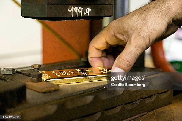 Gold Stamp Injection Gold Bar Stamp Photos and Premium High Res Pictures - Getty Images