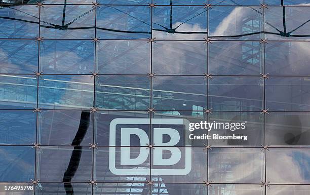 The logo of Deutsche Bahn AG sits on display on the windows of Berlin Central Station, also known as Hauptbahnhof, in Berlin, Germany, on Tuesday,...