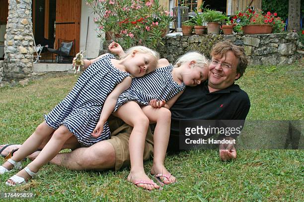 In this handout image supplied by Rijks Voorlichtings Dienst , Prince Friso of The Netherlands poses with his daughters Countess Zaria of the...