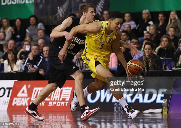 Tom Abercrombie of New Zealand and Ben Simmons of Australia in action during the Men's FIBA Oceania Championship match between the New Zealand Tall...