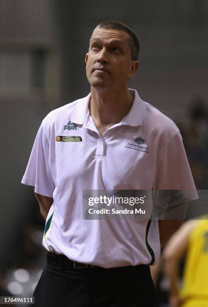 Andre Lemanis, coach of Australia looks to the score board during the Men's FIBA Oceania Championship match between the New Zealand Tall Blacks and...