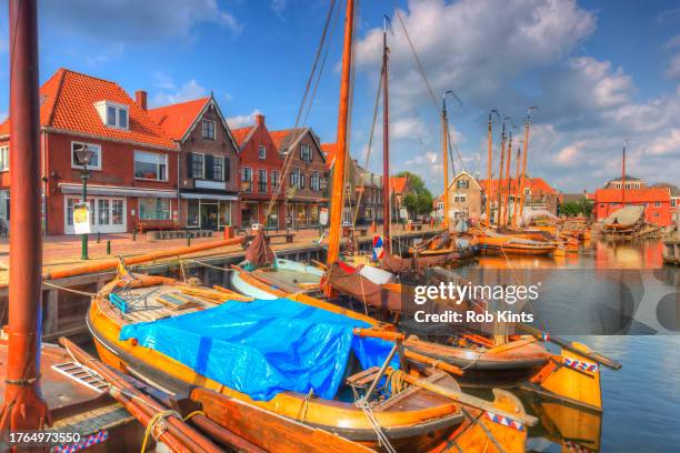 dutch flat-bottomed boats ( platbodems ) in spakenburg harbor near amsterdam - ijsselmeer stock pictures, royalty-free photos & images