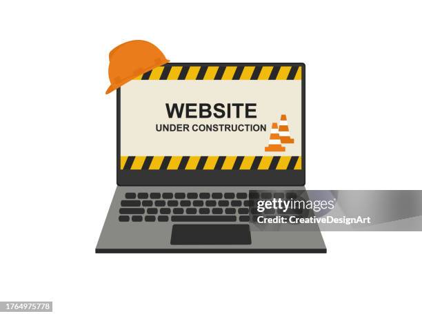 website under construction page on laptop screen with traffic cones and hard hat - traffic cone stock illustrations