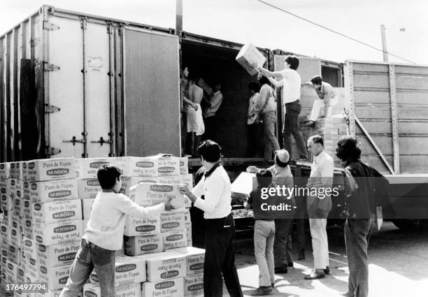 Students from the three universities of Santiago participate in volunteers brigades, in November 1972, to unload and distribute food which had...