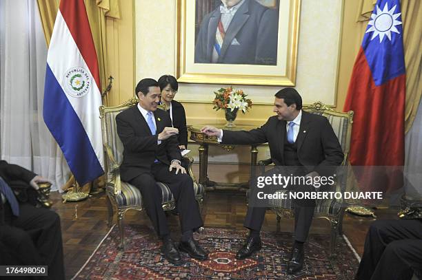 Taiwanese President Ma Ying Jeuo and Paraguayan outgoing President Federico Franco meet at the presidential palace in Asuncion on August 14, 2013. Ma...