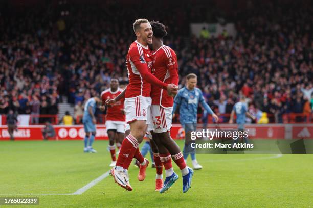 Ola Aina of Nottingham Forest celebrates scoring the opening goal with Harry Toffolo during the Premier League match between Nottingham Forest and...