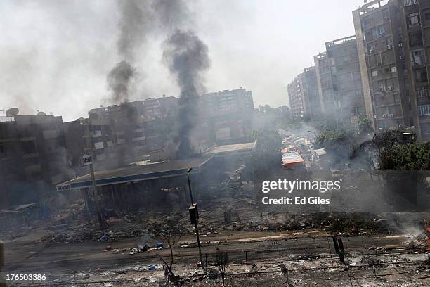 Plumes of smoke rise from a damaged petrol station during a violent crackdown by Egyptian Security Forces on a pro-Morsi sit-in demonstration at the...