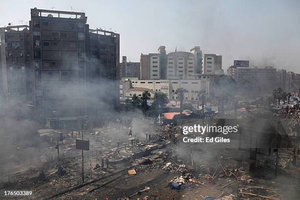 Plumes of smoke rise from the site of a protest in support of deposed Egyptian President Mohammed Morsi during a violent crackdown by Egyptian...