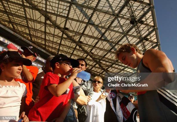 Shane Woewodin signs autographs during Collingwood's pre season training session at Telstra Stadium at Homebush Bay in Sydney, Australia on February...