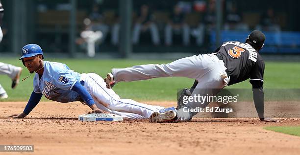 Jarrod Dyson of the Kansas City Royals slides into second for a steal past Adeiny Hechavarria of the Miami Marlins in the third inning at Kauffman...