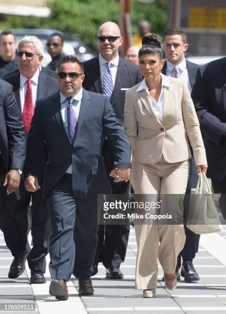 Giuseppe "Joe" Giudice and wife Teresa Giudice appear in court to face charges of defrauding lenders, illegally obtaining mortgages and other loans...