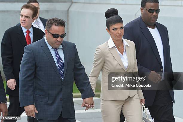 Giuseppe "Joe" Giudice and wife Teresa Giudice appear in court to face charges of defrauding lenders, illegally obtaining mortgages and other loans...