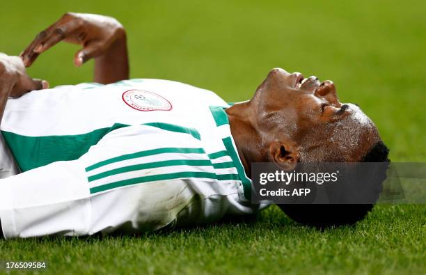 Nigeria's Obinna Nsofor lies on the ground following an injury during the 2013 Nelson Mandela football Challenge friendly match between South Africa...