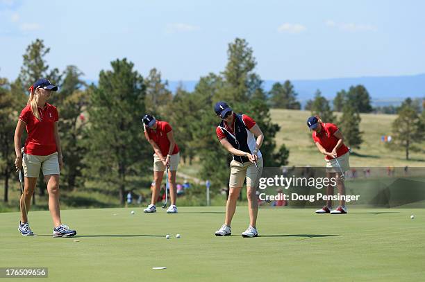 Teammates Jessica Korda, Paula Creamer, Morgan Pressel and Cristie Kerr of the USA putt on the 15th green during the 2013 Solheim Cup on August 14,...