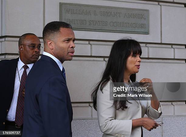 Former Congressman Jesse Jackson Jr. And his wife Sandi Jackson leave the federal court house after being sentenced to prison, August 14, 2013 in...