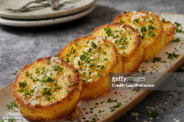 crispy parmesan polenta cakes - cornmeal stock pictures, royalty-free photos & images