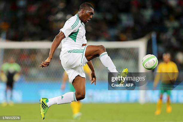 Nigeria's Azubuike Egwuekwe controls the ball during a 2013 Nelson Mandela football Challenge friendly match between South Africa and Nigeria at...