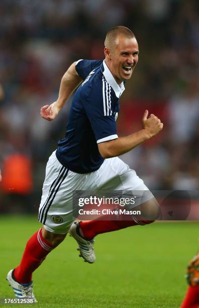 Kenny Miller of Scotland celebrates after scoring a goal during the International Friendly match between England and Scotland at Wembley Stadium on...