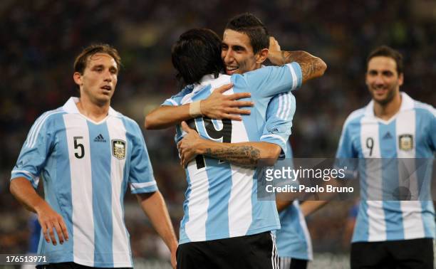 Ever Banega of Argentina celebrates with team-mates Angel Di Maria , Lucas Biglia and Gonzalo Higuain after scoring the second team's goal during the...