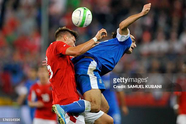 Greece's Lazaros Christodoulopulos fights for the ball with Austria's Sebastian Prodl during the friendly football match Austria vs Greece in...
