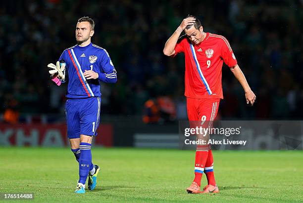 Artem Dzyuba and Igor Akinfeev of Russia look dejected after defeat to Northern Ireland in the FIFA 2014 World Cup Group F Qualifier match between...