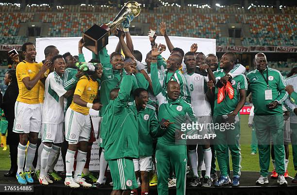 Nigeria's football team celebrates its victory after the 2013 Nelson Mandela Challenge football match against South Africa at the Moses Mabhida...