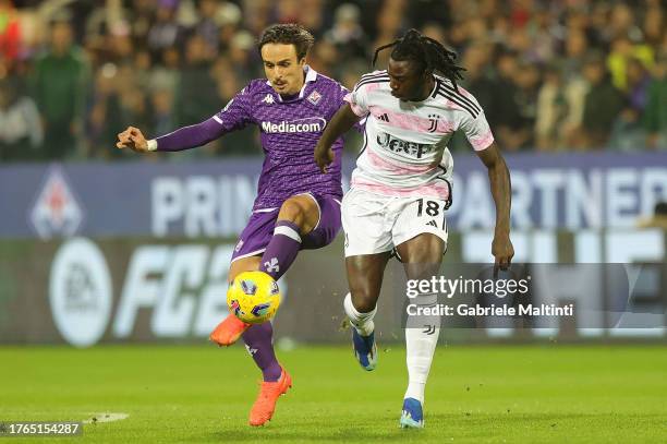 Luca Ranieri of ACF Fiorentina battles for the ball with Moise Kean of Juventus during the Serie A TIM match between ACF Fiorentina and Juventus at...